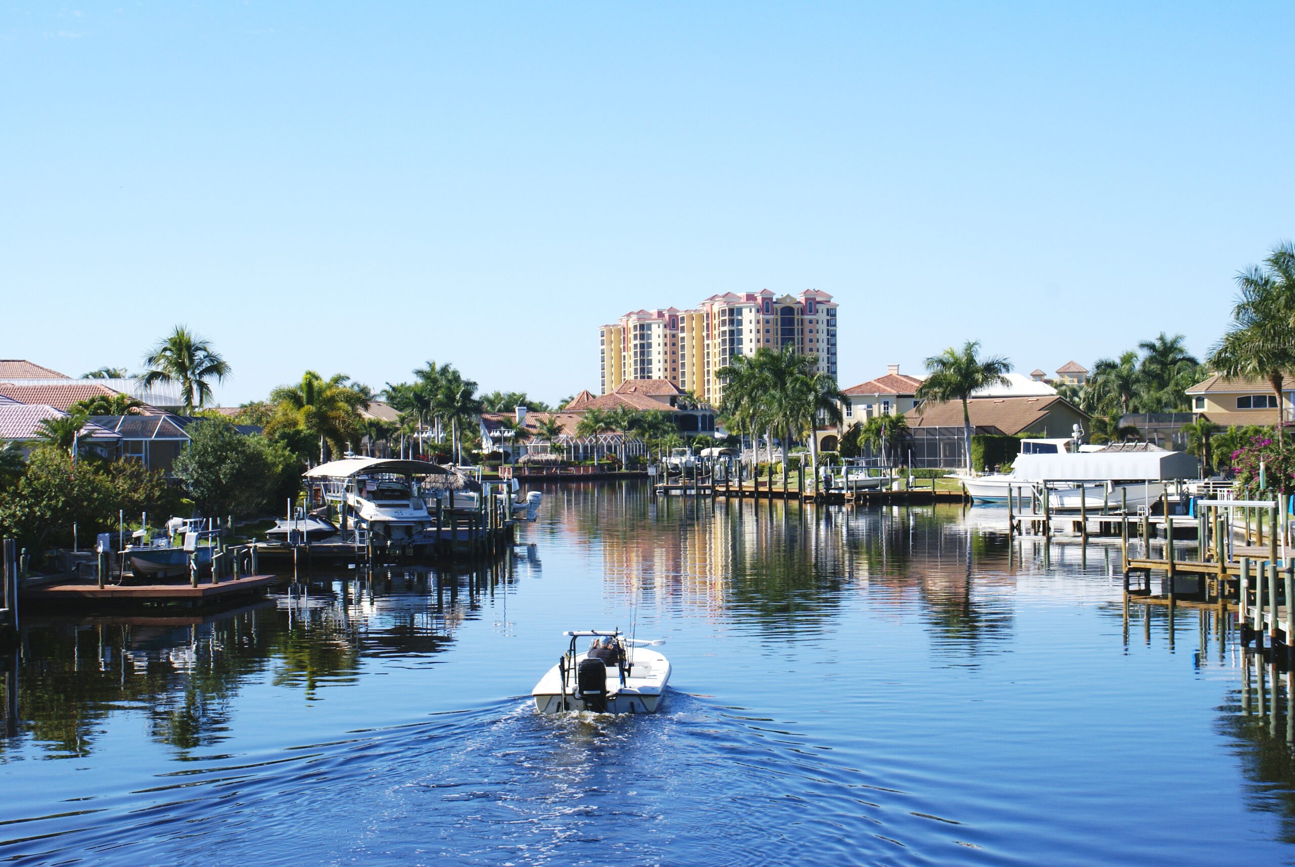 Boating Along Canal In Cape Coral, Florida
